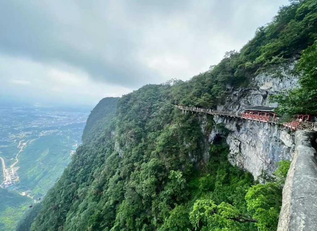 a train on a bridge over a cliff